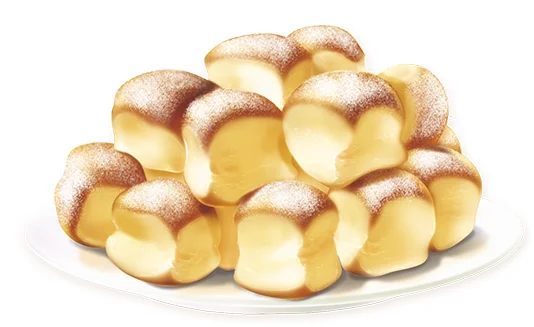 Malé zlaté koláče s pudrem na talíři